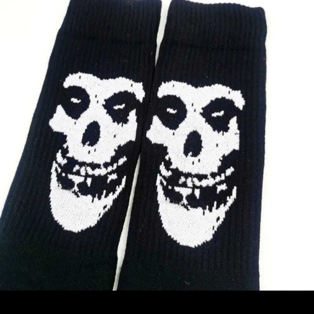 Misfits socks. 'Misfits ' printed vertically on the back of the socks